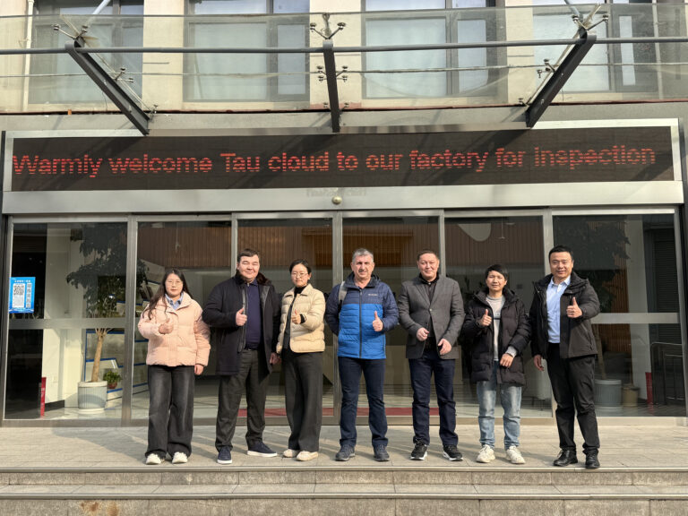 Coolnet team and Kazakhstan partners at factory entrance for 540KW data center inspection
